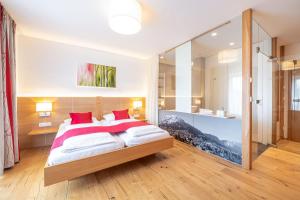 Ένα ή περισσότερα κρεβάτια σε δωμάτιο στο Hotel Loy