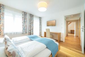 Ένα ή περισσότερα κρεβάτια σε δωμάτιο στο Hotel Loy