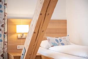 Ένα ή περισσότερα κρεβάτια σε δωμάτιο στο Hotel Loy