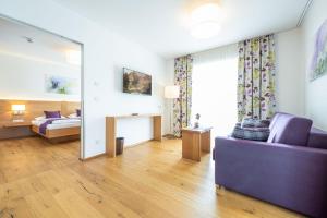 Ένα ή περισσότερα κρεβάτια σε δωμάτιο στο Hotel Loy