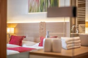 Ένα ή περισσότερα κρεβάτια σε δωμάτιο στο Hotel Loy