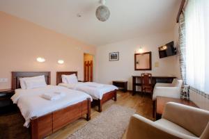 Postel nebo postele na pokoji v ubytování Hotel Zlatni bor