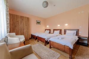 Postel nebo postele na pokoji v ubytování Hotel Zlatni bor