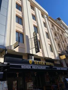 a large building with a sign for a hotel at Seher HOTEL in Istanbul