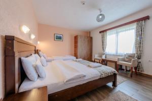 Postel nebo postele na pokoji v ubytování Hotel Zlatni bor