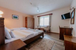 Postel nebo postele na pokoji v ubytování Hotel Zlatni bor