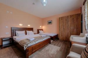 Postel nebo postele na pokoji v ubytování Hotel Zlatni bor