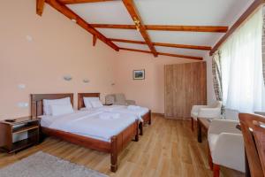 Postel nebo postele na pokoji v ubytování Hotel Zlatni bor