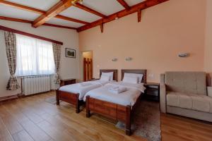 Postel nebo postele na pokoji v ubytování Hotel Zlatni bor