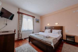 Postel nebo postele na pokoji v ubytování Hotel Zlatni bor