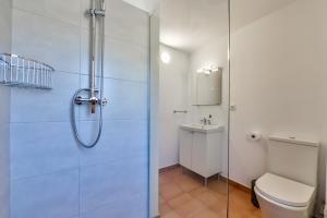 a bathroom with a shower and a toilet and a sink at LA MAR - Managed by Almarina in Benissa +92 photos