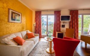 TV a/nebo společenská místnost v ubytování Das Moser - Hotel Garni am See (Adults Only)