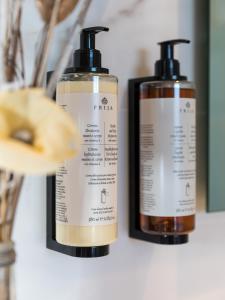 two bottles of hair products sitting on a counter at Senator Gandia in Gandía