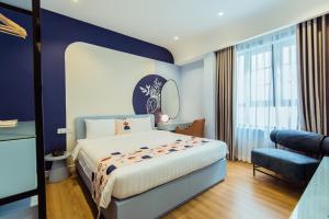 Giường trong phòng chung tại Palette Collect's Boutique Hotel Ha Long