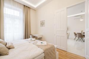 Postel nebo postele na pokoji v ubytování BpR Étienne Charming Apartment