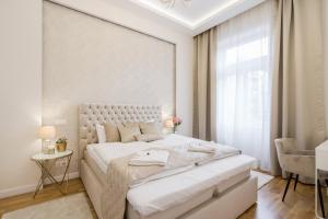 Postel nebo postele na pokoji v ubytování BpR Étienne Charming Apartment