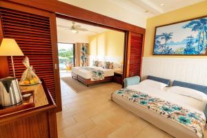 Postel nebo postele na pokoji v ubytování Maritim Resort & Spa Mauritius