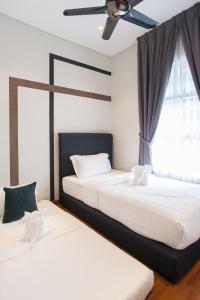 Ένα ή περισσότερα κρεβάτια σε δωμάτιο στο GH KLCC Apartment by GuestHouse +42 φωτογραφίες