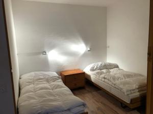 Postel nebo postele na pokoji v ubytování Apartment Residenza Quadra Flims