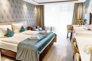 מיטה או מיטות בחדר ב-Haus am See Luxury HS 228 B