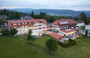 an aerial view of a large building in a town at Wander- & Wellnesshotel Nägele in Höchenschwand