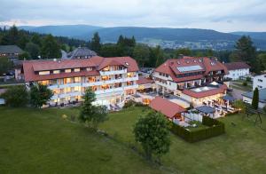 an aerial view of a large building in a town at Wander- & Wellnesshotel Nägele in Höchenschwand