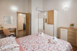 Postel nebo postele na pokoji v ubytování Villa Gracia