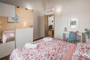 Postel nebo postele na pokoji v ubytování Villa Gracia