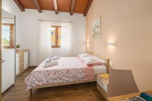 Postel nebo postele na pokoji v ubytování Villa Gracia