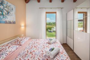 Katil atau katil-katil dalam bilik di Villa Gracia