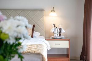 Postel nebo postele na pokoji v ubytování Hotel Novi Sad