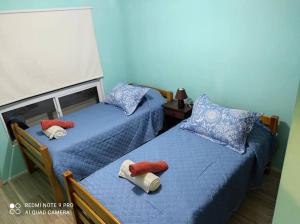En eller flere senge i et værelse på Casa 5-6 Personas Puerto Natales