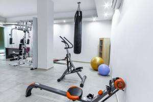 a gym with weights and exercise equipment on the floor at Skopelos Holidays Hotel & Spa in Skopelos Town