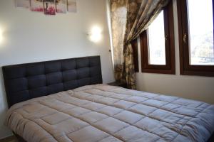 Postel nebo postele na pokoji v ubytování Ξενώνας Παρατηρητήριο Υπερώον