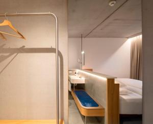 Letto o letti in una camera di FIRMAMENT Hotel