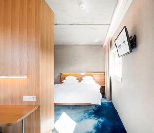 Letto o letti in una camera di FIRMAMENT Hotel