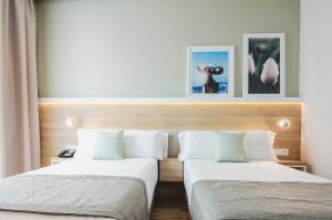 Postel nebo postele na pokoji v ubytování Golden Hotel Barcelona
