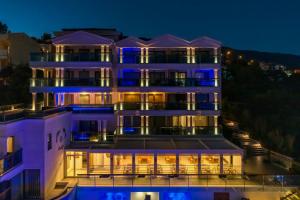 a building with blue lights on it at night at Meis Exclusive Hotel in Kaş