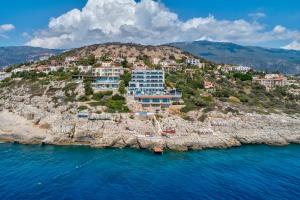 an aerial view of a resort on a rocky island at Meis Exclusive Hotel in Kaş