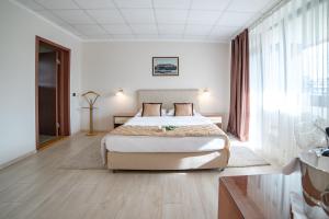 Krevet ili kreveti u jedinici u okviru objekta Hotel Novi Sad