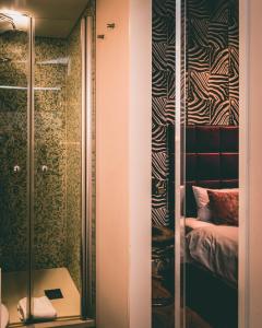Cama ou camas em um quarto em Hotel Villa Klemm - Wiesbaden City