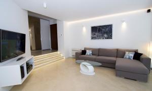 a living room with a couch and a television at Luxury Apartment Split in Split