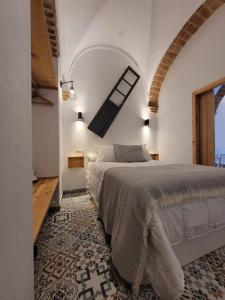 מיטה או מיטות בחדר ב-Casa Cuna