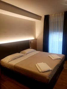 Posteľ alebo postele v izbe v ubytovaní Hotel Cantaleone