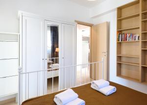a room with a table with two white towels on it at Botanica Villas & Apartments in Neos Marmaras +131 photos