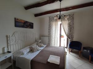 Postel nebo postele na pokoji v ubytování Patrizia Casa Vacanze
