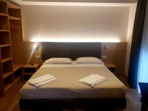 Posteľ alebo postele v izbe v ubytovaní Hotel Cantaleone