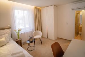 A bed or beds in a room at Hotel U Kaplicky