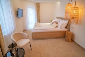 A bed or beds in a room at Hotel U Kaplicky