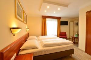 Ein Bett oder Betten in einem Zimmer der Unterkunft Hotel Beretta